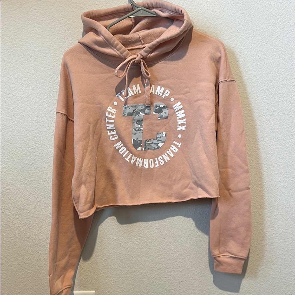 The Camp Transformation Center Women's Pink Crop Hoodie